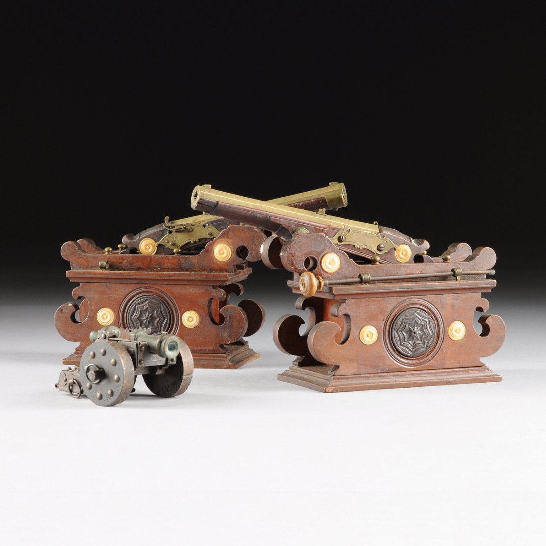 A PAIR OF LATE 19TH CENTURY, ITALIAN/SPANISH BRONZE: A PAIR OF LATE 19TH CENTURY, ITALIAN/SPANISH BRONZE MATCHLOCK HAND CANNONS, TOGETHER WITH A MINIATURE BRONZE CANNON, POSSIBLY SPAIN/LATIN AMERICAN, each hand cannon having an octagonal bronze barrel e