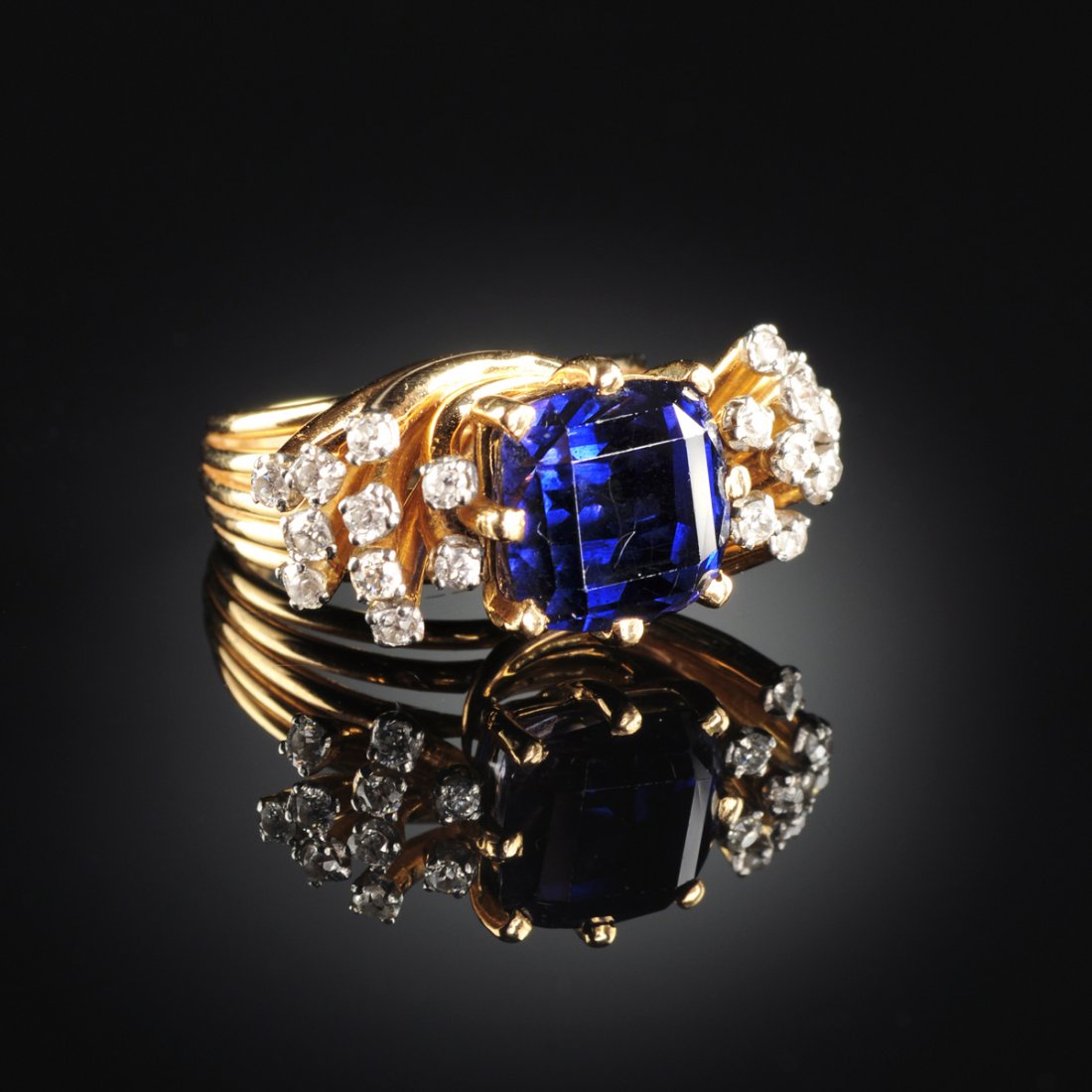 AN 18K YELLOW GOLD, SAPPHIRE, AND DIAMOND LADY'S RING,: AN 18K YELLOW GOLD, SAPPHIRE, AND DIAMOND LADY'S RING, the mounting centering one square faceted natural blue sapphire measuring 9.94 x 9.5 millimeters, GIA Colored Stone Grading System : Color - Hue: