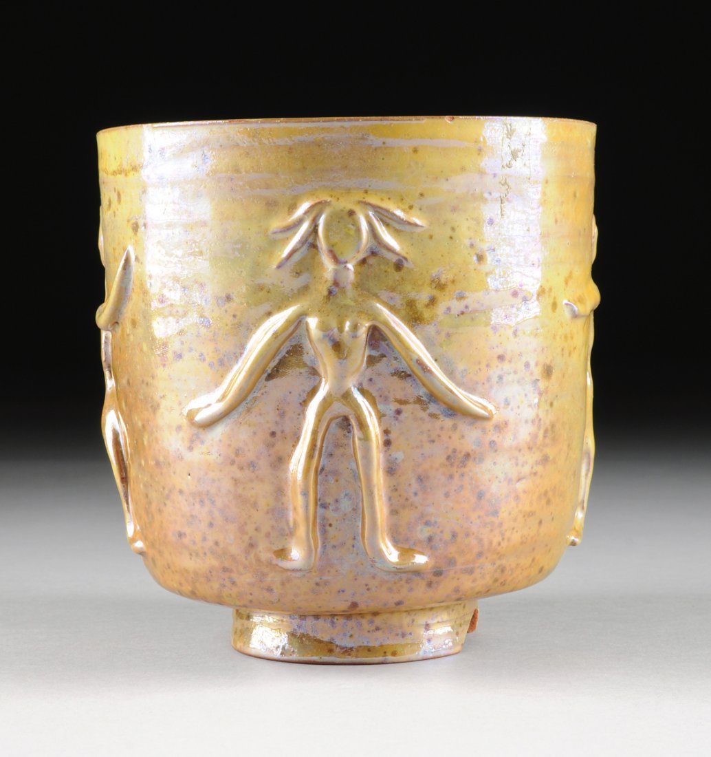 BEATRICE WOOD (American 1893-1998) A LUSTER GLAZED: BEATRICE WOOD (American 1893-1998) A LUSTER GLAZED EARTHENWARE FIGURAL VASE, OJI, CALIFORNIA, CIRCA 1960, of tapered cylindrical shape with applied alternating male and female figures on speckled shad