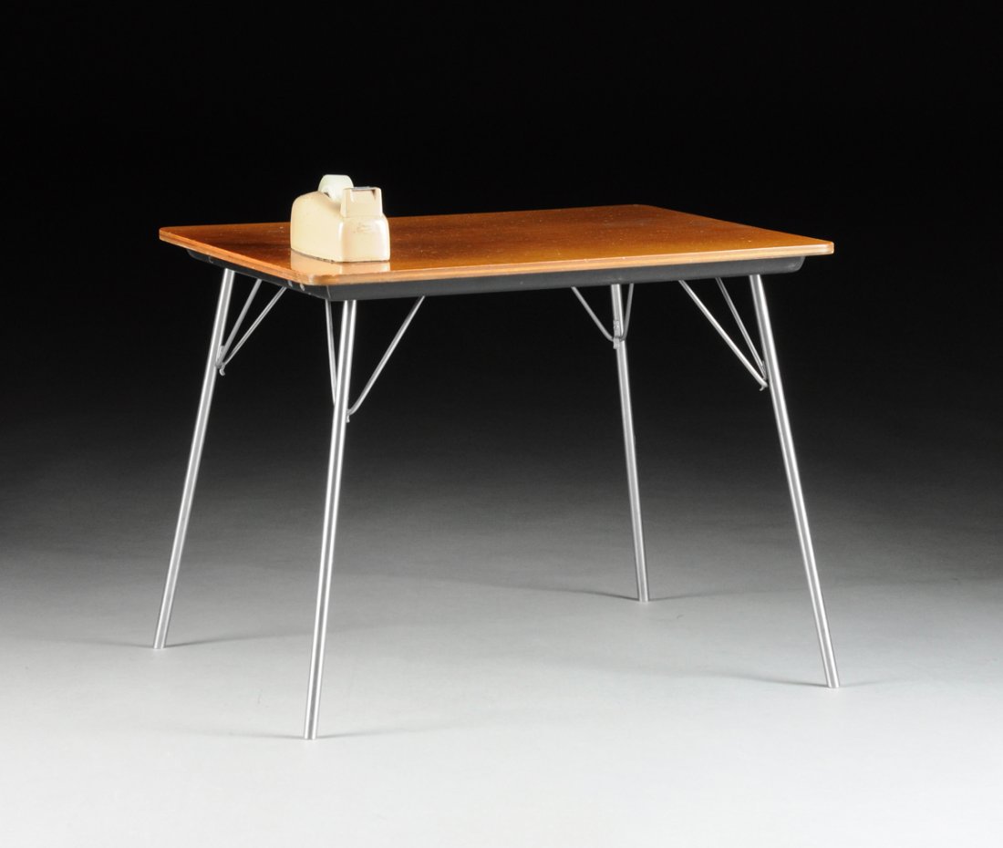 CHARLES AND RAY EAMES (American 1907-1978/1912-1988) A: CHARLES AND RAY EAMES (American 1907-1978/1912-1988) A CHILD'S FOLDING TABLE, MODEL IT-1, FOR HERMAN MILLER, INC., ZEELAND, MICHIGAN, DESIGNED 1947, with stained walnut plywood top and folding chrome 