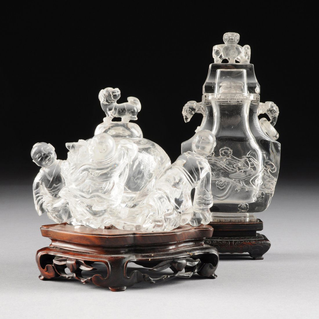 TWO CHINESE CARVED ROCK CRYSTAL LIDDED VESSELS, 20TH: TWO CHINESE CARVED ROCK CRYSTAL LIDDED VESSELS, 20TH CENTURY, one modeled as a figural lidded brushpot with smiling boys in traditional attire playfully crawling on a globular brush pot, surmounted by