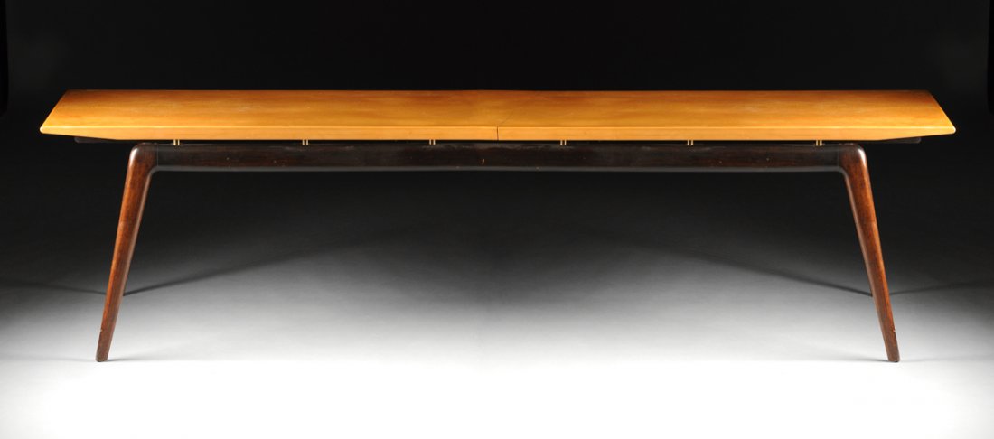 ROBIN DAY (British 1915-2010) A LACQUERED MAHOGANY,: ROBIN DAY (British 1915-2010) A LACQUERED MAHOGANY, MAPLE, AND BRASS EXTENDING DINING TABLE, FOR S. HILLE & CO., WATFORD, ENGLAND, DESIGNED 1949, the base of tapered splayed leg form in lacquered maho