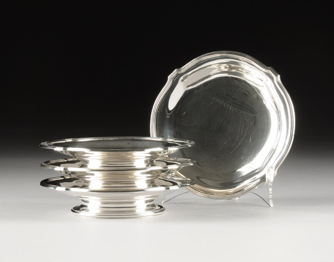 A SET OF FOUR GUSTAVE KELLER 950 STANDARD SILVER FOOTED: A SET OF FOUR GUSTAVE KELLER 950 STANDARD SILVER FOOTED TAZZAS, PARIS, FRANCE, CIRCA 1900, of bracketed circular form raised on spreading conforming foot, marked to the bottom (G. KELLER, PARIS, GK wi