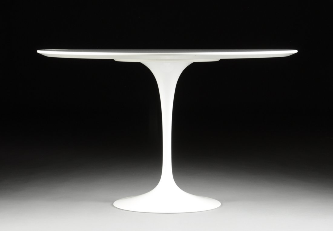 EERO SAARINEN (American/Finnish 1910-1961) "TULIP: EERO SAARINEN (American/Finnish 1910-1961) "TULIP TABLE," A DINING TABLE, the laminate top supported by and enameled aluminum base bearing the Knoll mark on the underneath. Production of this table is
