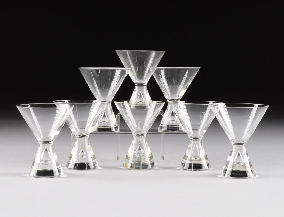 GEORGE THOMPSON (American 20th Century) A SET OF EIGHT: GEORGE THOMPSON (American 20th Century) A SET OF EIGHT "TEARDROP" MARTINI GLASSES, MODEL 7826, FOR STEUBEN GLASS WORKS, CORNING, NEW YORK, CIRCA 1950, of hourglass form with trapped air bubble to the 