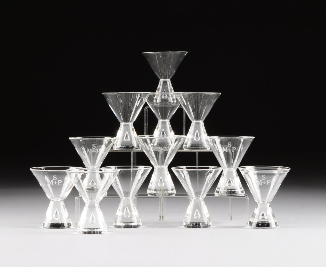 GEORGE THOMPSON (American 20th Century) A SET OF TWELVE: GEORGE THOMPSON (American 20th Century) A SET OF TWELVE "TEARDROP" MARTINI GLASSES, MODEL 7826, FOR STEUBEN GLASS WORKS, CORNING, NEW YORK, CIRCA 1950, of hourglass form with trapped air bubble to the