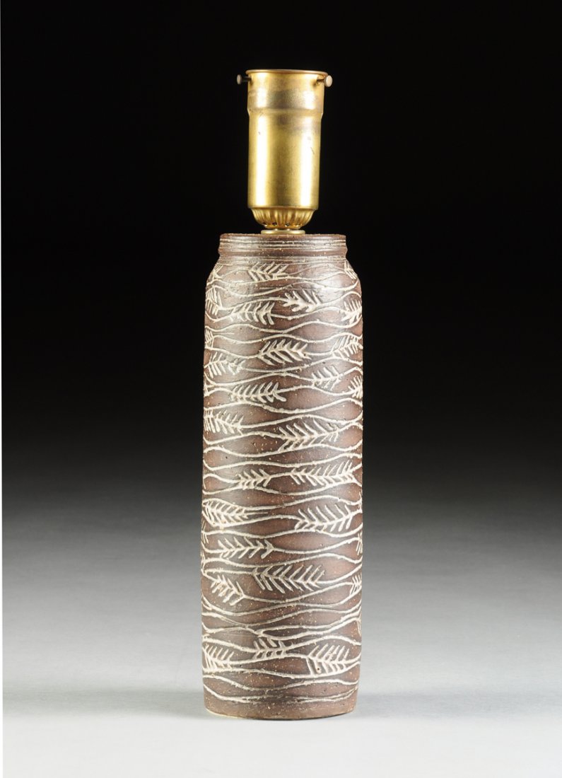 NANCY WICKHAM BOYD (American b. 1923) A GLAZED: NANCY WICKHAM BOYD (American b. 1923) A GLAZED STONEWARE TABLE LAMP WITH SHADE, FOR THE VERMONT WORKSHOP, WOODSTOCK, VERMONT, CIRCA 1955, the columnar form lamp of brown salt glazed stoneware with inc
