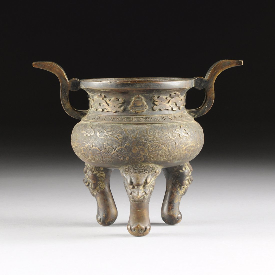 A CHINESE ARCHAISTIC STYLE PATINATED BRONZE DING, LATE (1 of 10)