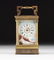 A POLYCHROME PAINTED PORCELAIN AND LACQUERED BRASS