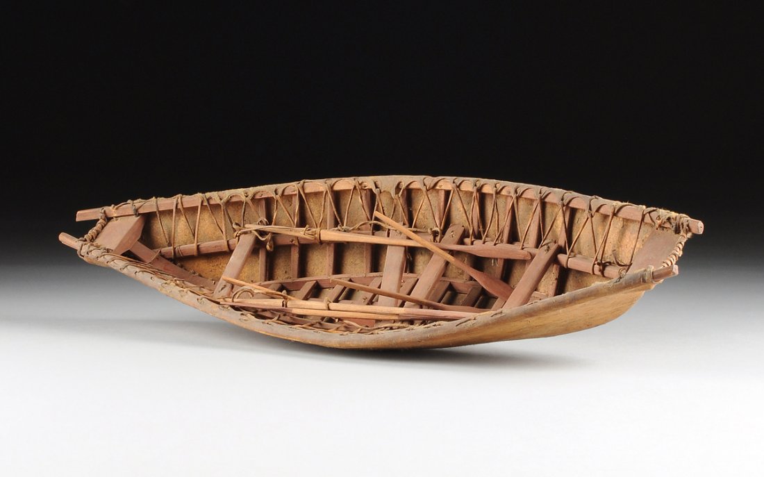 A VINTAGE ESKIMO LACED SEAL SKIN AND CARVED WOOD MODEL (1 of 9)