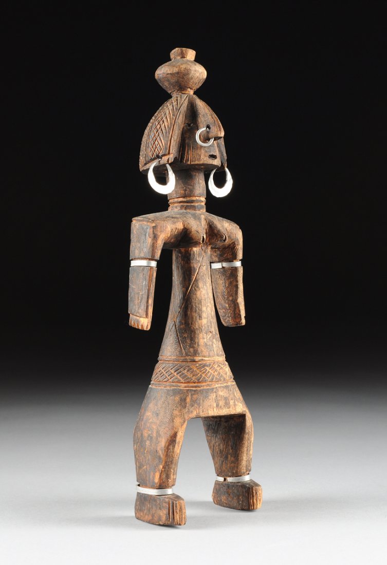 AN AFRICAN TRIBAL ALUMINUM JEWELRY MOUNTED CARVED WOOD (1 of 9)