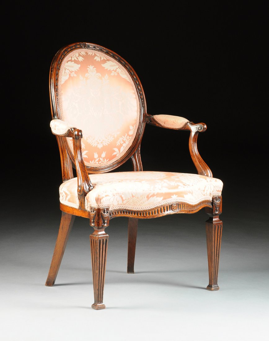 A GEORGE III MAHOGANY OPEN ARMCHAIR, SECOND HALF 18TH: A GEORGE III MAHOGANY OPEN ARMCHAIR, SECOND HALF 18TH CENTURY, in the manner of Thomas Chippendale (English 1719-1779), the oval rose floral silk damask later upholstered back, the cresting with husk