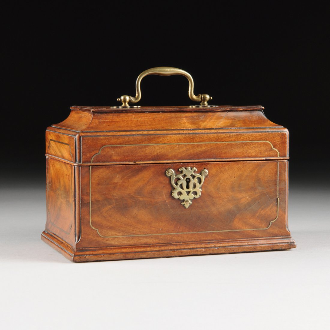 A GEORGE II BRASS INLAID FLAME MAHOGANY TEA CADDY, (1 of 8)