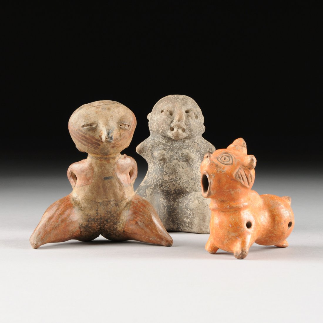 A GROUP OF THREE PRE- COLUMBIAN EARTHENWARE FIGURES, (1 of 10)