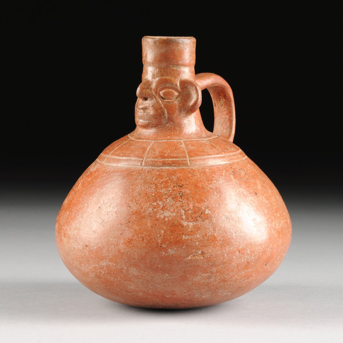 A PRE-COLUMBIAN HANDLED HUMAN EFFIGY VESSEL, POSSIBLY (1 of 9)