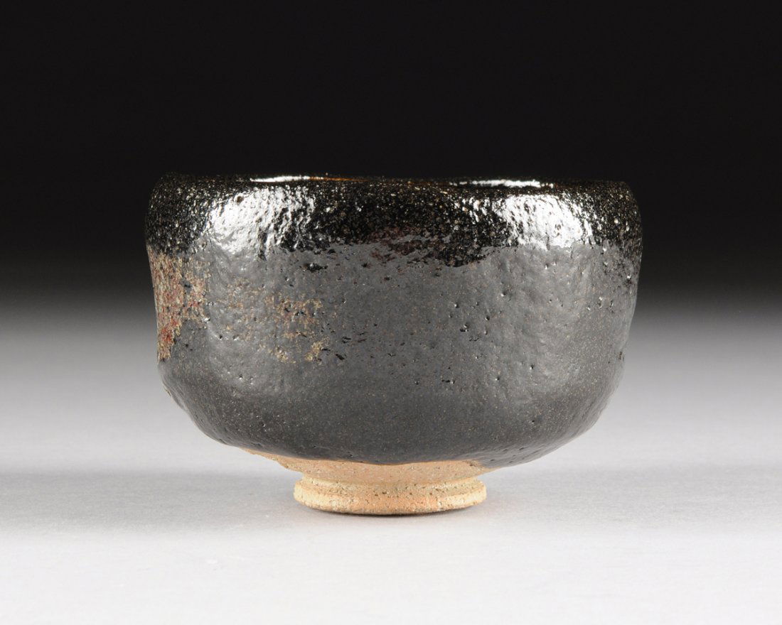 A JAPANESE STUDIO POTTERY BLACK SALT GLAZED TEA BOWL, (1 of 5)