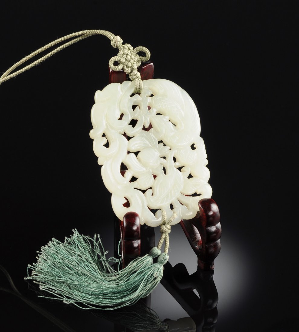 A CHINESE CARVED CELADON JADE PENDANT, 20TH CENTURY, (1 of 3)