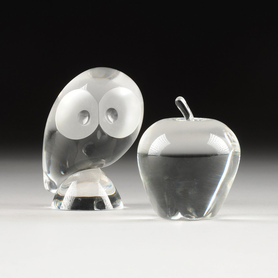 TWO STEUBEN CLEAR AND FROSTED CRYSTAL PAPERWEIGHTS, (1 of 7)