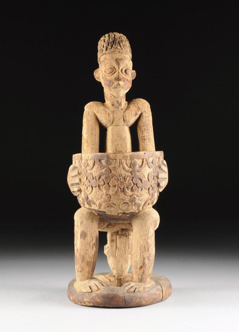 AN AFRICAN TRIBAL CARVED WOOD FIGURAL OFFERINGS BOWL, (1 of 10)