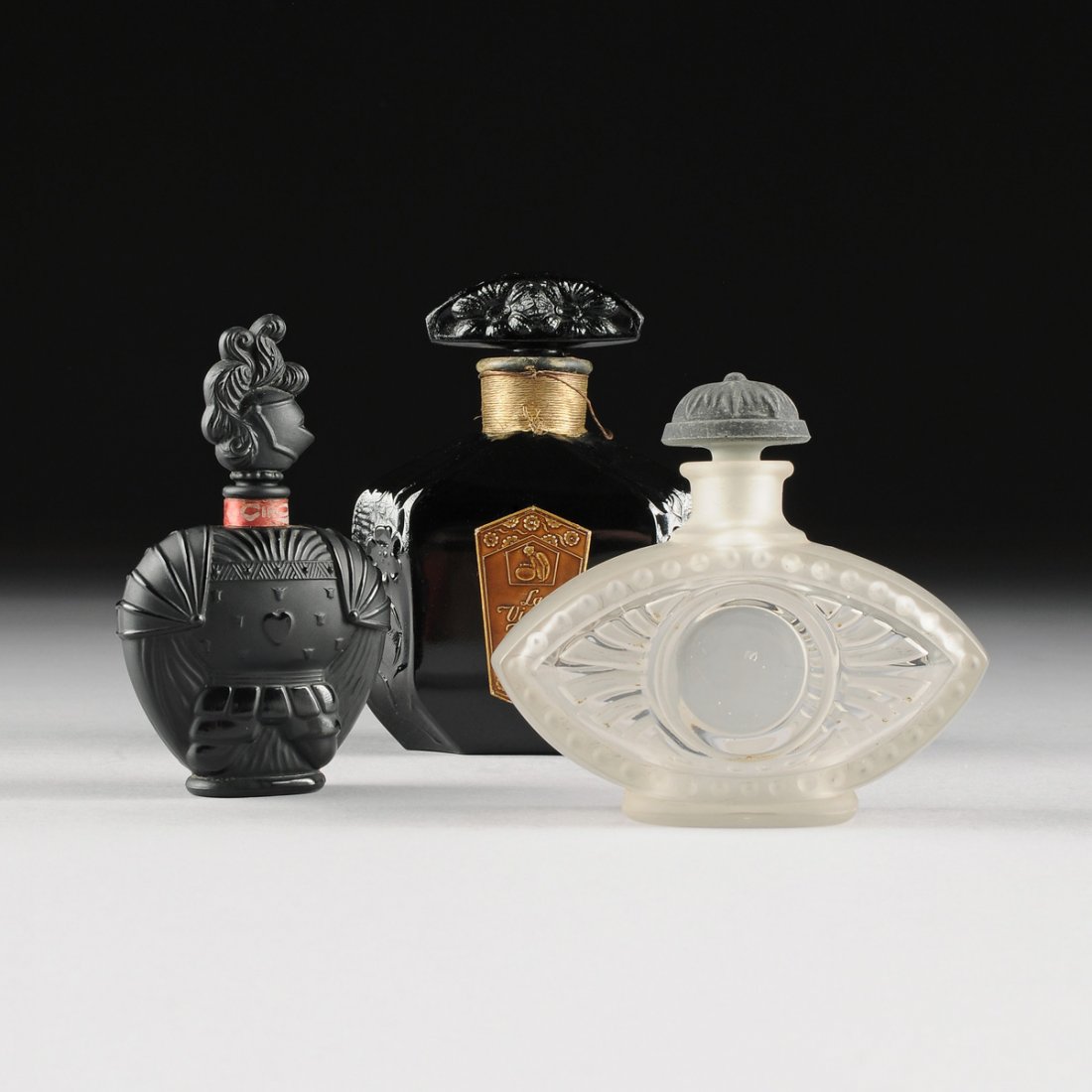 A GROUP OF THREE FRENCH ART DECO GLASS PERFUME BOTTLES, (1 of 10)