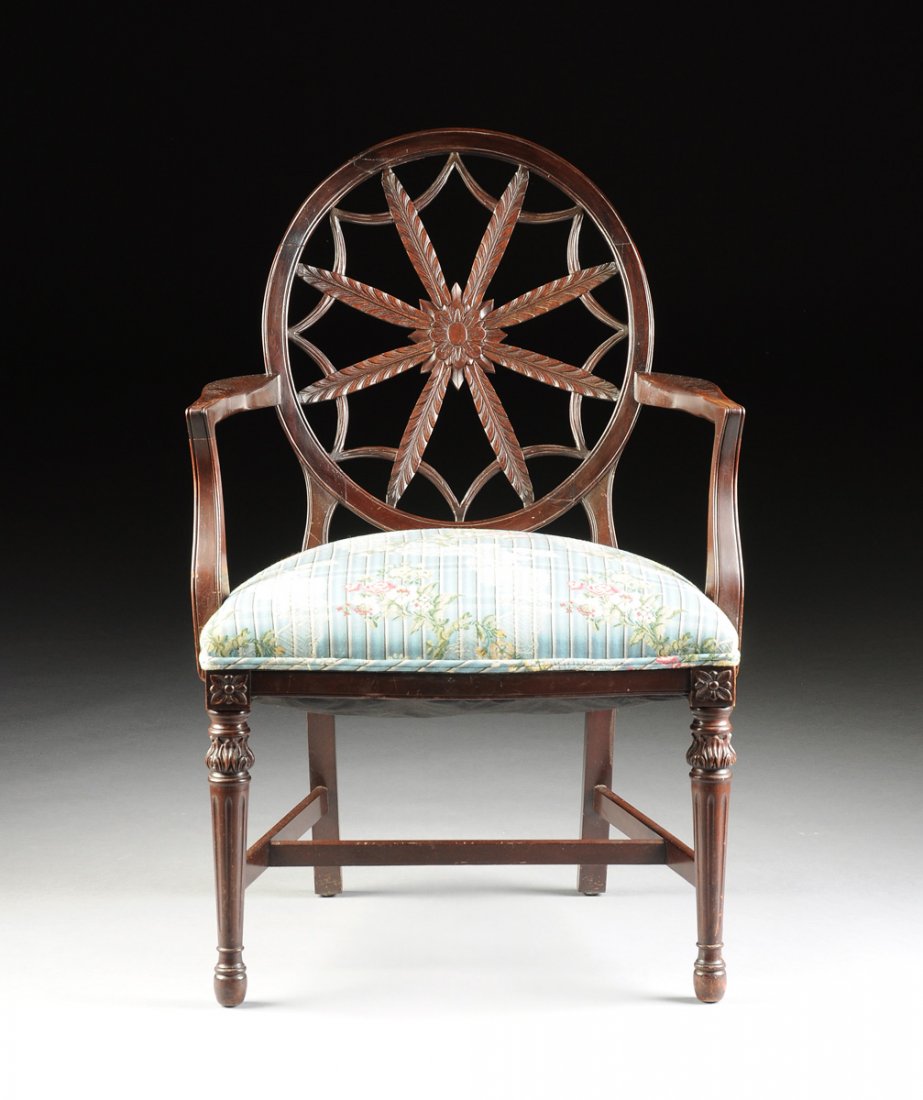 AN ENGLISH EDWARDIAN MAHOGANY WHEEL BACK OPEN ARMCHAIR,: AN ENGLISH EDWARDIAN MAHOGANY WHEEL BACK OPEN ARMCHAIR, CIRCA 1900, in the manner of Robert Adams (Scottish 1728-1792), bearing the characteristic circular pierced splat enclosing palm leaves radiatin