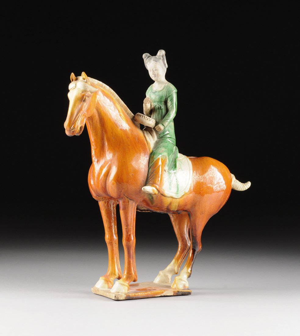 A CHINESE SANCAI GLAZED EQUESTRIAN MAIDEN MUSICIAN, (1 of 10)