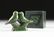 AN INUIT CARVED SPINACH JADE GROUP OF LOVE BIRDS
