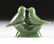 AN INUIT CARVED SPINACH JADE GROUP OF LOVE BIRDS - 2