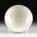 A CHINESE INCISED AND WHITE GLAZED SHALLOW BOWL,