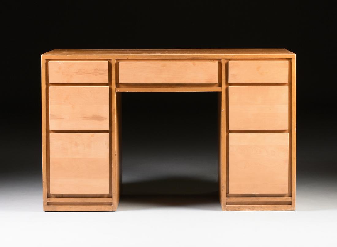 A RUSSEL WRIGHT (American 1904-1976) "AMERICAN MODERN": A RUSSEL WRIGHT (American 1904-1976) "AMERICAN MODERN" BIRCH SEVEN DRAWER DESK, FOR CONANT-BALL, GARDNER, MASSACHUSETTS, CIRCA 1935-1949, of rectangular form with two stacks of three drawers to each s