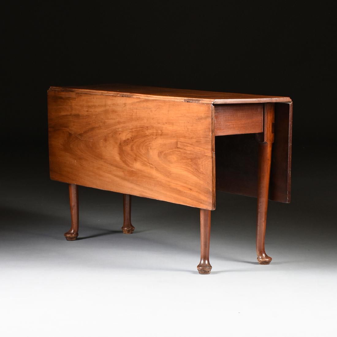 A COLONIAL MAHOGANY DROP LEAF DINING TABLE, CIRCA (1 of 5)