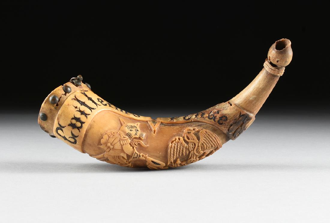 AN ITALIAN CARVED AND INSCRIBED "PUSS IN BOOTS" POWDER (1 of 4)