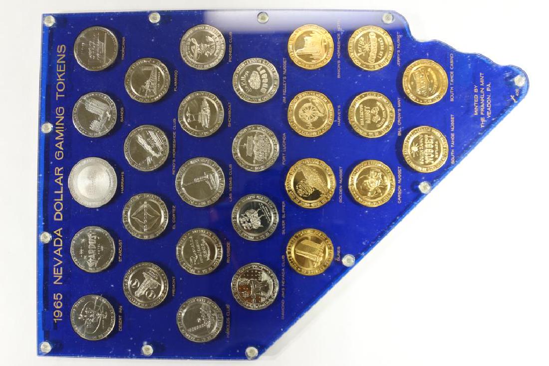 1965 NEVADA DOLLAR GAMING TOKENS IN NICE (1 of 2)