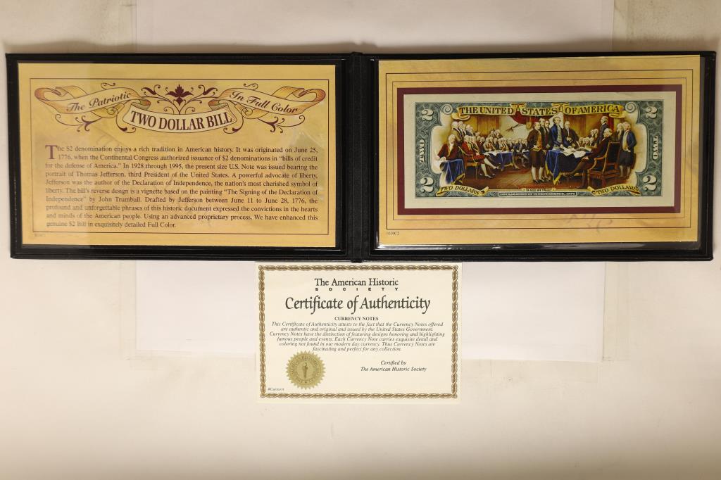 GENUINE COLORIZED US $2 BILL WITH CERTIFICATE: IN NICE BLACK FOLIO WITH A SMALL BACK STORY FROM THE AMERICAN HISTORIC SOCIETY