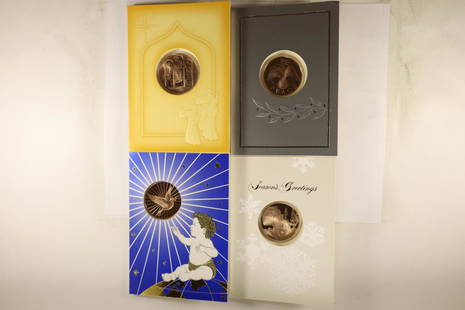 4 FRANKLIN MINT HOLIDAY CARDS WITH 1 1/2": BRONZE TOKENS THAT ARE BRILLIANT UNC SEALED IN PLASTIC WITHIN THE CARDS