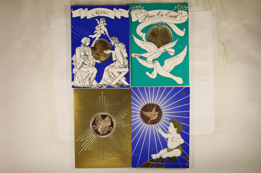 4 FRANKLIN MINT HOLIDAY CARDS WITH 1 1/2": BRONZE TOKENS THAT ARE BRILLIANT UNC SEALED IN PLASTIC WITHIN THE CARDSS