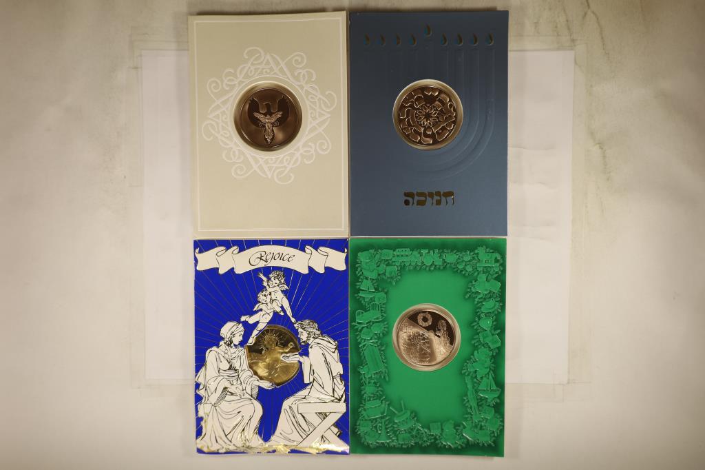 4 FRANKLIN MINT HOLIDAY CARDS WITH 1 1/2": BRONZE TOKENS THAT ARE BRILLIANT UNC SEALED IN PLASTIC WITHIN THE CARDS