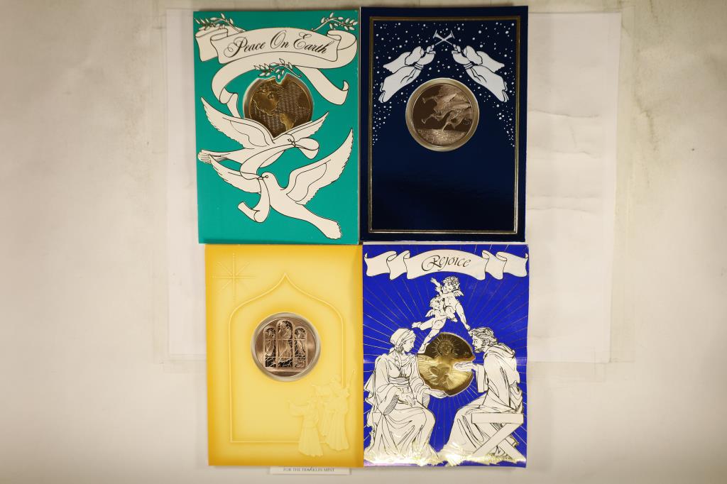 4 FRANKLIN MINT HOLIDAY CARDS WITH 1 1/2": BRONZE TOKENS THAT ARE BRILLIANT UNC SEALED IN PLASTIC WITHIN THE CARDS