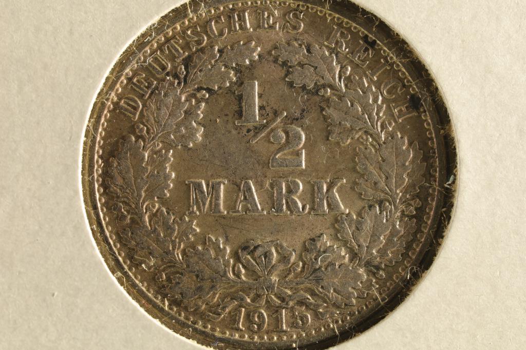 1915-G GERMAN SILVER HALF MARK EXTRA FINE .0802 (1 of 2)