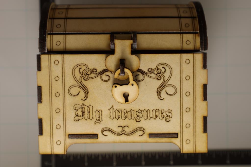 WOOD CUSTOM LASER CUT TREASURE CHEST COIN BANK.: 4 1/2" X 3" X 4 1/4". LOCK IS FOR DECORATION AND AND HOLDS LID IN PLACE. DOES NOT LOCK.
