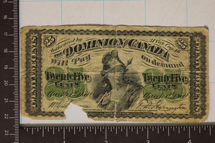 25 CENT DOMINION OF CANADA BILL WITH A PIECE