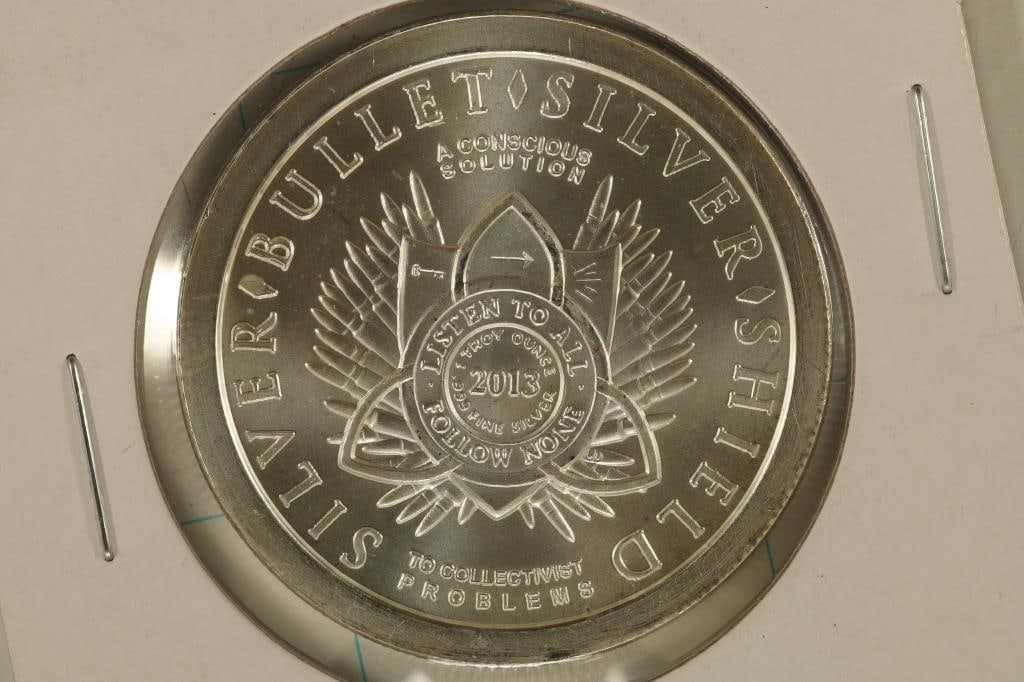 1 TROY OZ .999 FINE SILVER UNC ROUND "SILVER: BULLET, SILVER SHIELD" ON OBVERSE AND SPREADING DEBT AND DEATH ON REVERSE