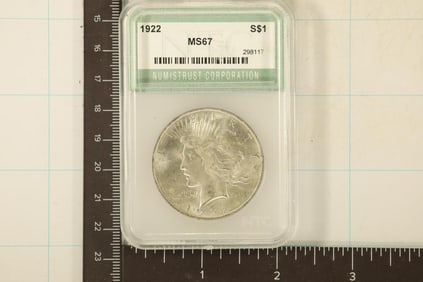 1922 PEACE SILVER DOLLAR IN A SLAB CLAIMING MS67