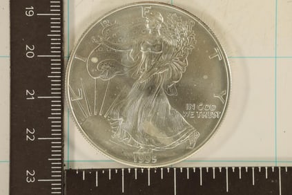 1995 AMERICAN SILVER EAGLE UNC WITH MILK SPOTS