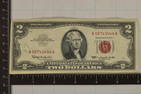 1963 US RED SEAL $2 NOTE, INK WRITING ON OBVERSE