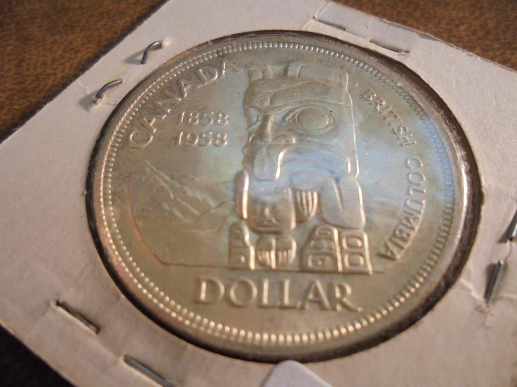 1958 CANADA TOTEM SILVER DOLLAR: You must call or email us with your credit card number directly
