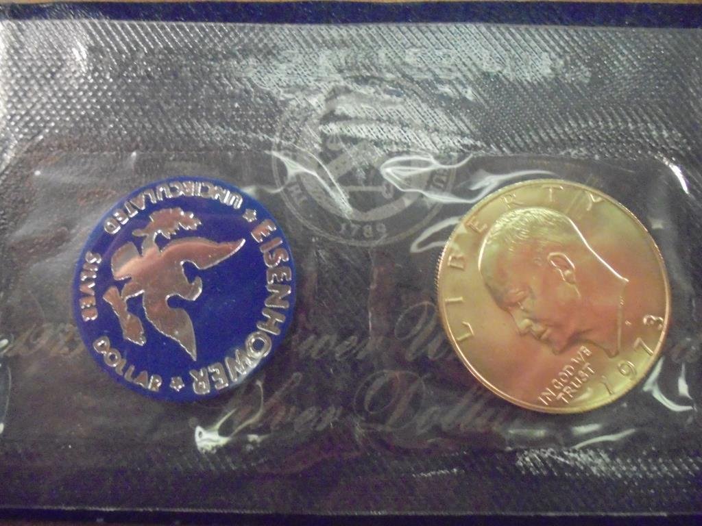 1973-S  IKE SILVER DOLLAR UNCIRCULATED (BLUE PACK) (1 of 2)