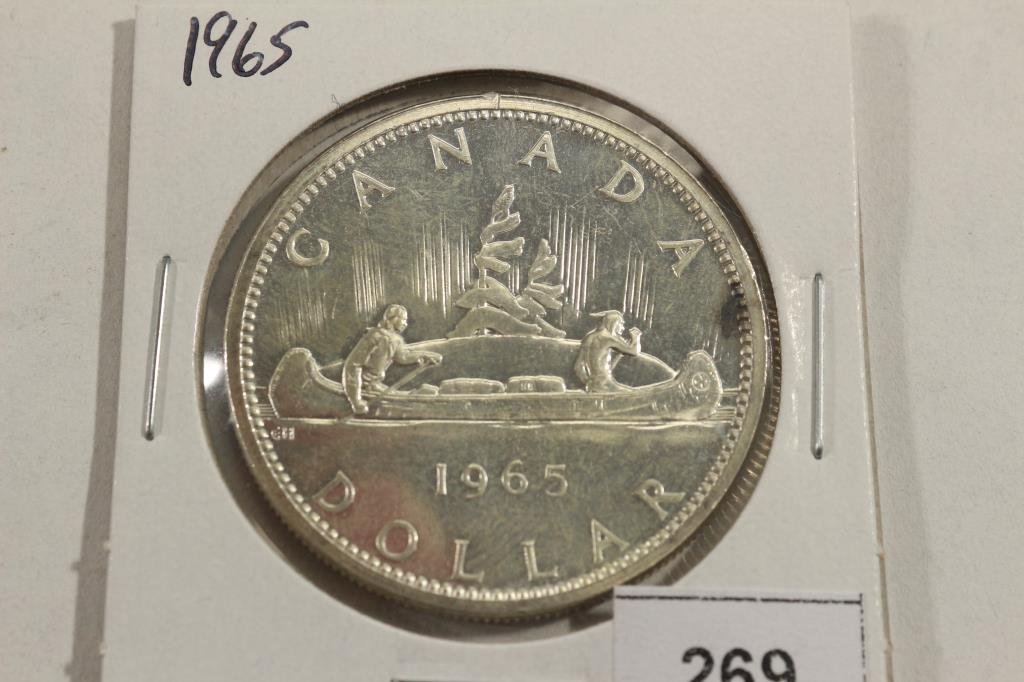 1965 CANADA SILVER DOLLAR UNC WITH TONING SPOT (1 of 2)