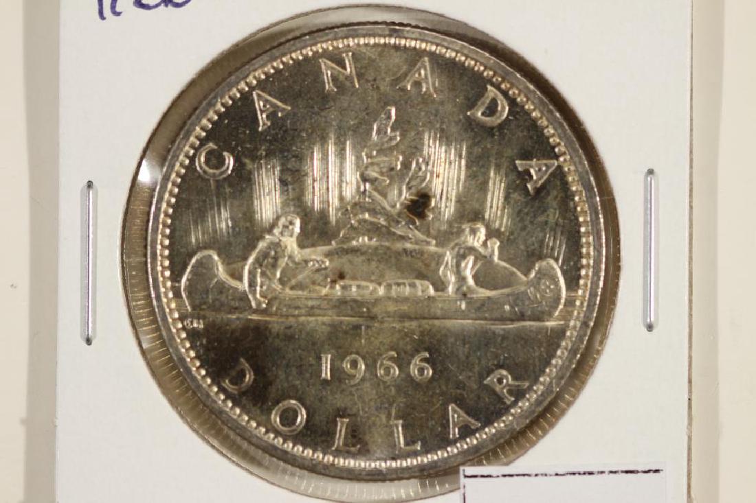 1966 CANADA SILVER DOLLAR UNC TONING SPOT: You must call or email us your credit card directly. Our phone number is 1-763-862-8302 and our email is bidalotauction@aol.com. Thanks.