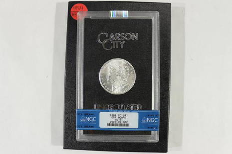 1884-CC MORGAN SILVER DOLLAR NGC MS61 COMES: WITH ORIGINAL BOX WITH A TORN LID